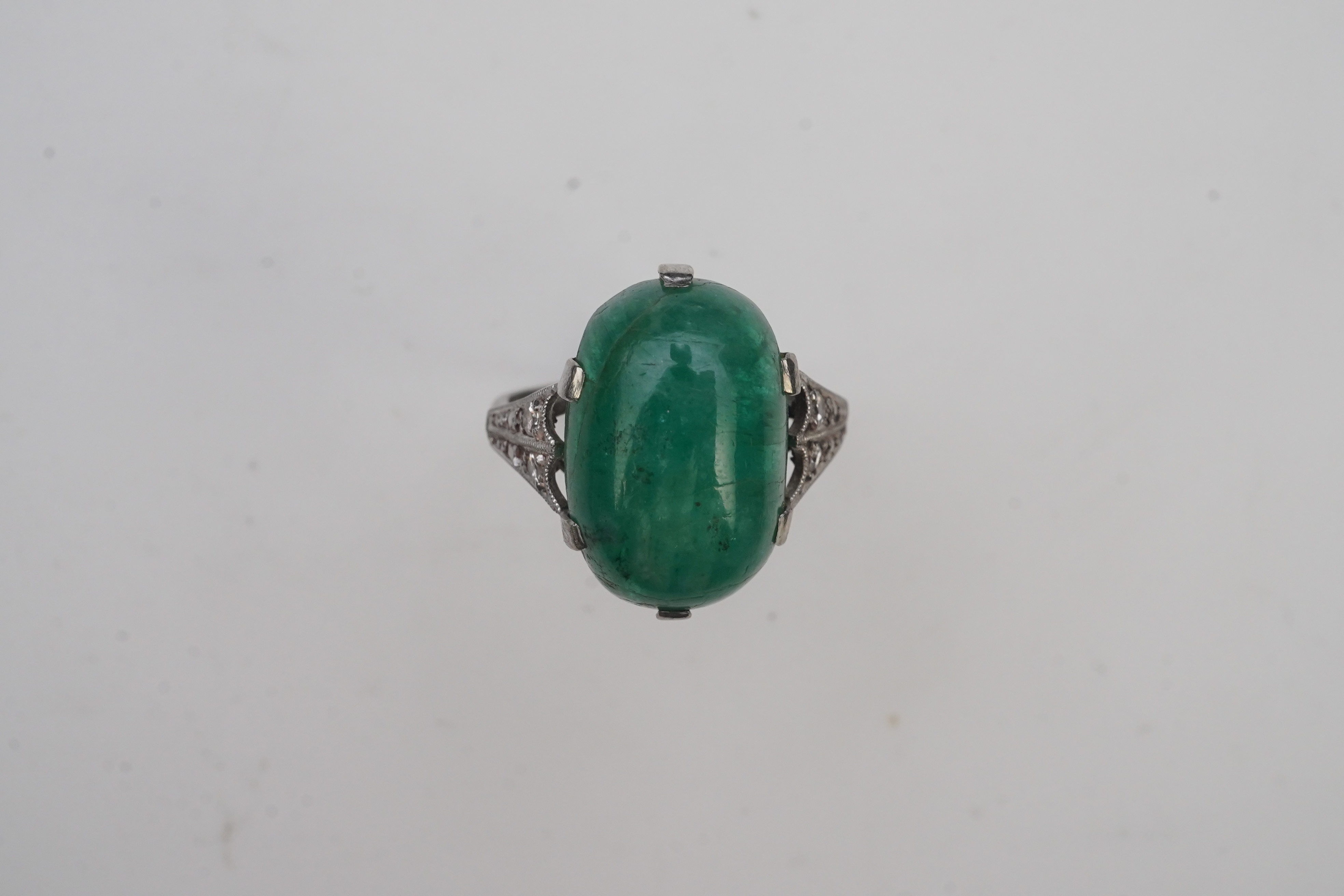 An emerald and diamond ring, early 20th century